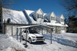 Gazebo Penguin Acay Carport in Grey with Gutters front angle view sheltering vehicle in winter