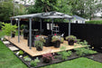 Gazebo Penguin Acay Carport in Grey with Gutters side angle view in a backyard used for gazebo shelter