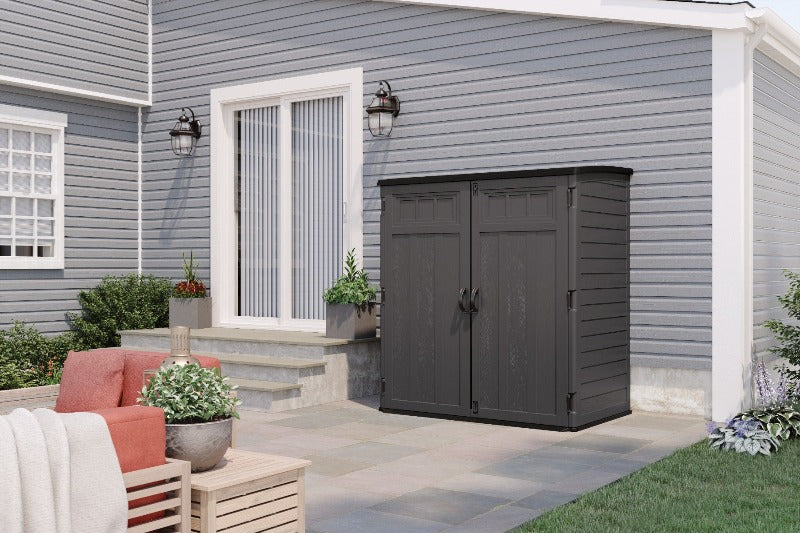 Backyard Lifestyles Suncast - XL Veritcal Shed 106 cu.ft. - Peppercorn front angle view of shed on a patio outdoors