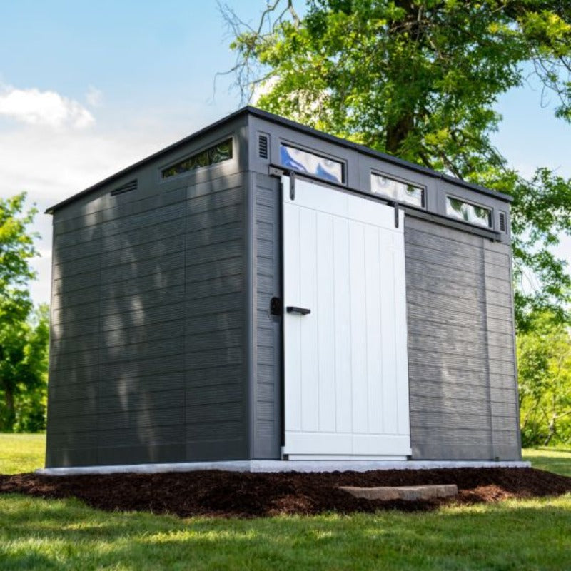 Backyard Lifestyles Modernist Barn Door 10'x7' Storage Shed - Peppercorn angle front view closed door outdoors