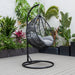 Backyard Lifestyles Hanging Swing Chair - SIngle Seater with Cushion - Small Basket side view with cushions outdoors