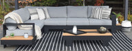 Black and Natural Striped Graphite Rug front view of rug outdoors with patio furniture