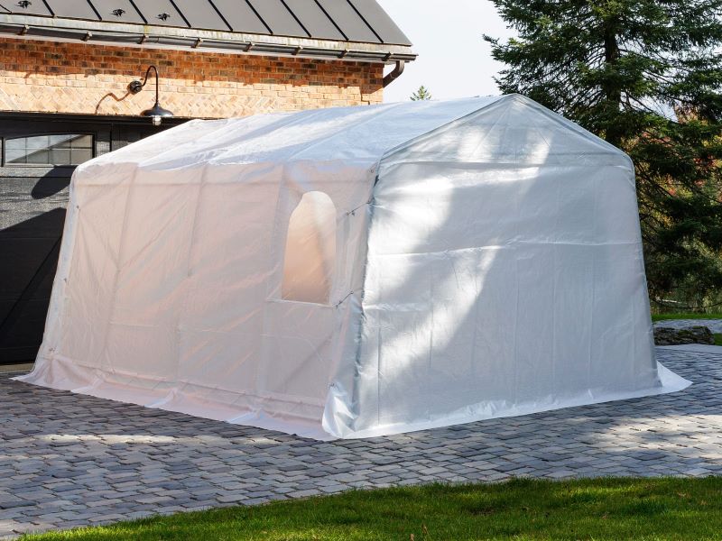 Gazebo Penguin Carport in White and Clear front angle view of clear shelter with closed car door