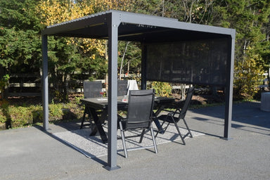 Casilda Pergola Louver with blinds - 10'x10' front angle outdoors on a patio with patio furniture underneath