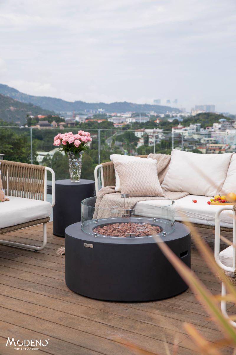 Backyard Lifestyles Modeno - Venice Fire Table front view of fire table outdoors on deck with patio furniture