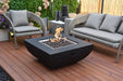 Bcakyard Lifestyles Modeno - Aurora Fire Table Square Black front angle view of fire table with flames on a deck with patio furniture