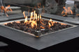 Backyard Lifestyles Modeno - Aurora Fire Table Square Black close up view of flames with rocks and glass shield