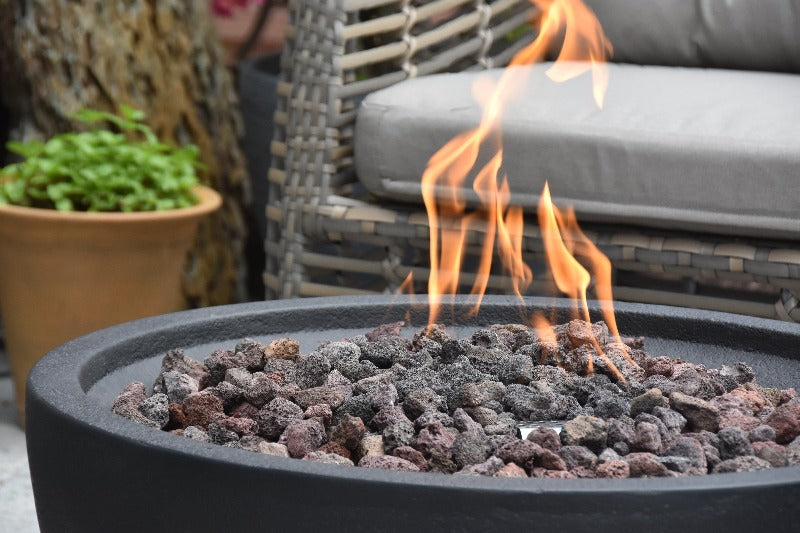 Backyard Lifestyles Modeno - Jefferson Fire Bowl close up view of lava rocks and flame in fire bowl