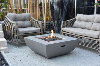 Backyard Lifestyles Modeno - Florence Fire Table - Natural Concrete front view of fire table on patio with outdoor furniture