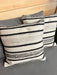 Patio Accessories: 18"x18" Outdoor Cushion Black Grey and Natural stripe close up of two pillows on outdoor sofa